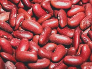 A vibrant close-up of fresh red kidney beans showcasing texture and color.